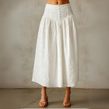 Side view of tiered floral skirt with smocked waist.