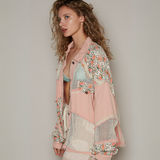 Side profile of a model wearing a floral mesh jacket with lightweight fabric, perfect for layering over casual outfits.