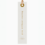 "Cream bookmark with gold scripture 'Pray without ceasing' - 1 Thessalonians 5:17."