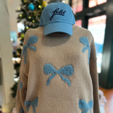 Front view of the Ribbon Pattern Balloon Sleeve Sweater, featuring a round neck and playful blue ribbon patterns on a beige background.