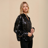 Side view of Sequin Button-Down Top showcasing shimmering sequins and relaxed fit design.