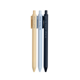 Faith-based pens writing spiritual phrases in ink, laid out on a flat-lay with a notepad.

