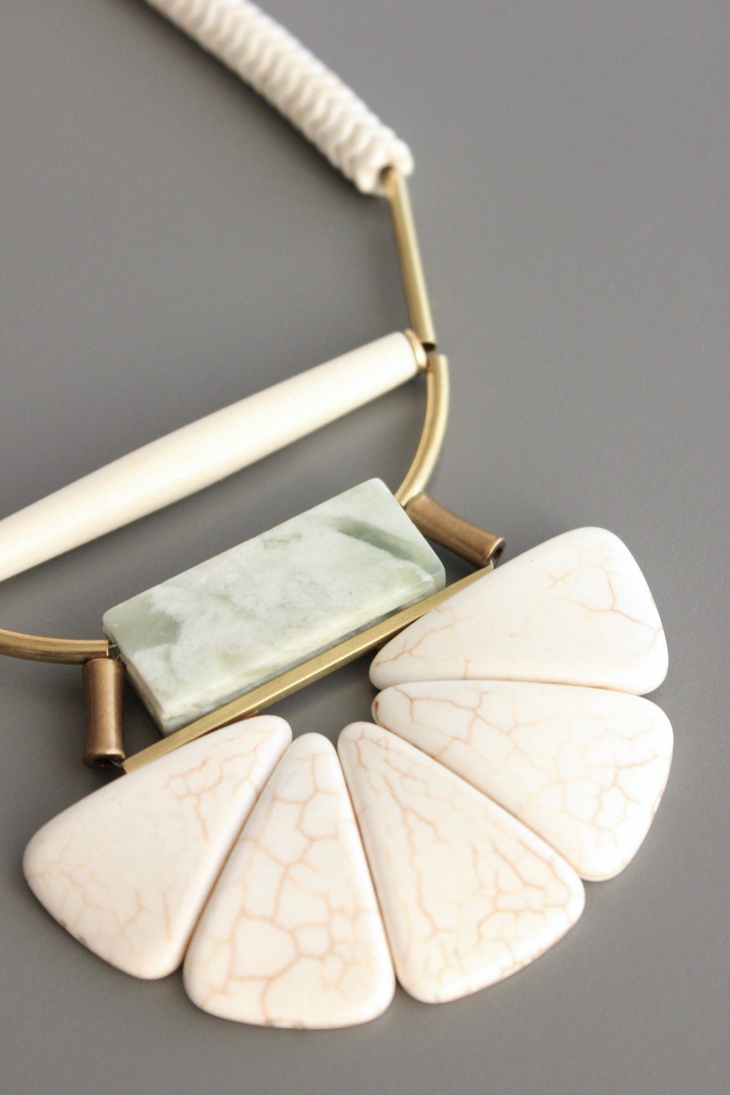 Magnesite, horn, serpentine, and brass necklace
