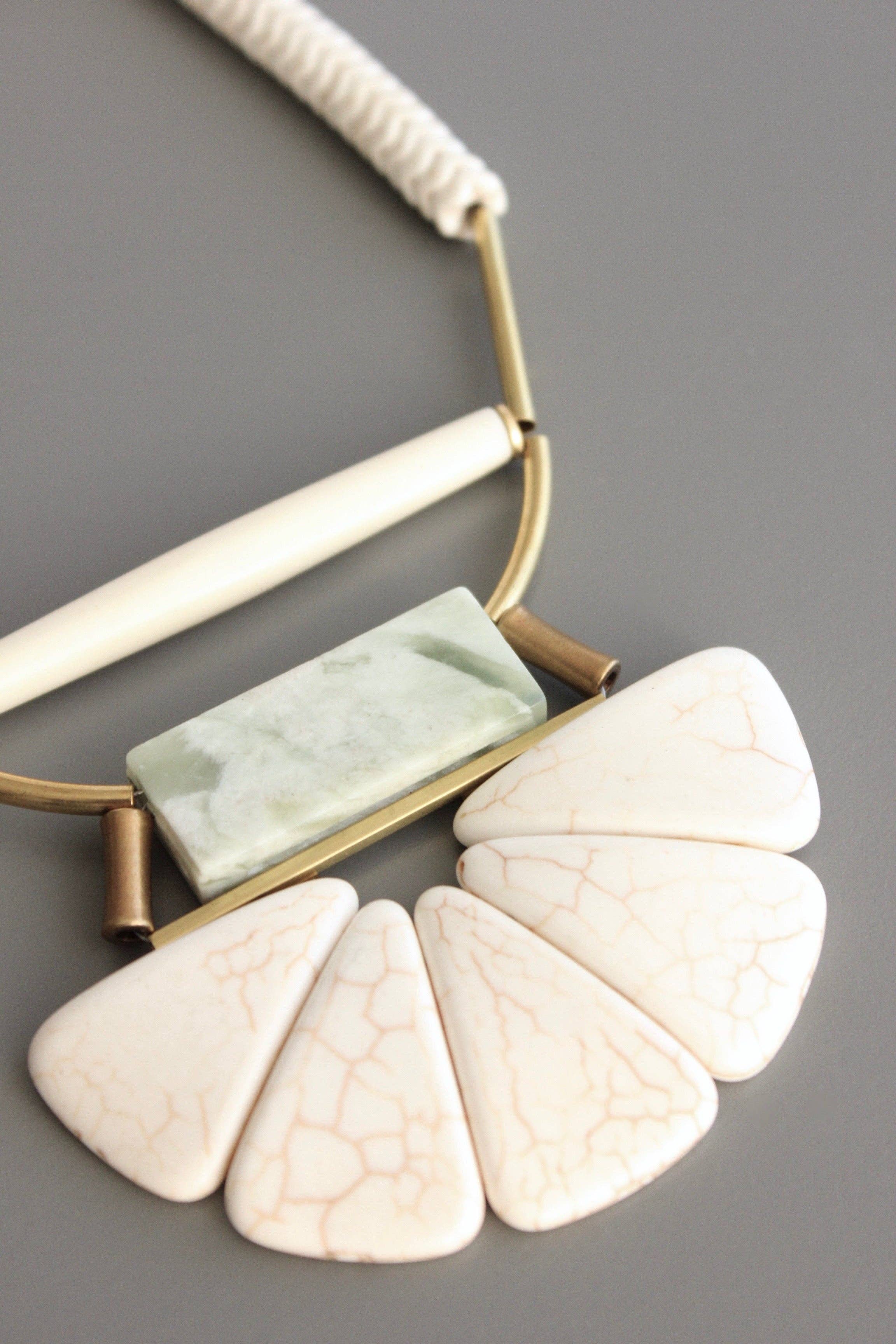 Magnesite, horn, serpentine, and brass necklace