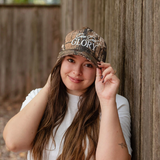 Outdoor shot of "Give God Glory" camo hat being worn, styled for a casual, faith-inspired look.