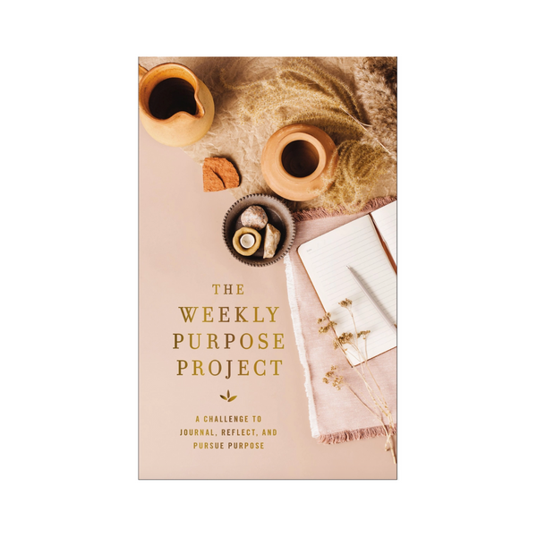 Flat lay photo of The Weekly Purpose Project journal with coffee and dried florals


