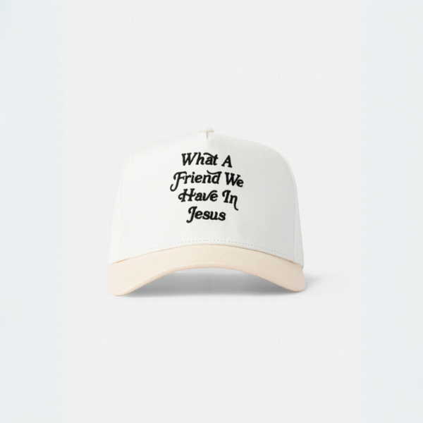 Close-up of the "What a Friend We Have in Jesus" embroidered trucker hat in cream and beige.