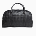 Black woven leather weekender duffel bag with top handles, front zipper pocket—ideal for travel and gym use.