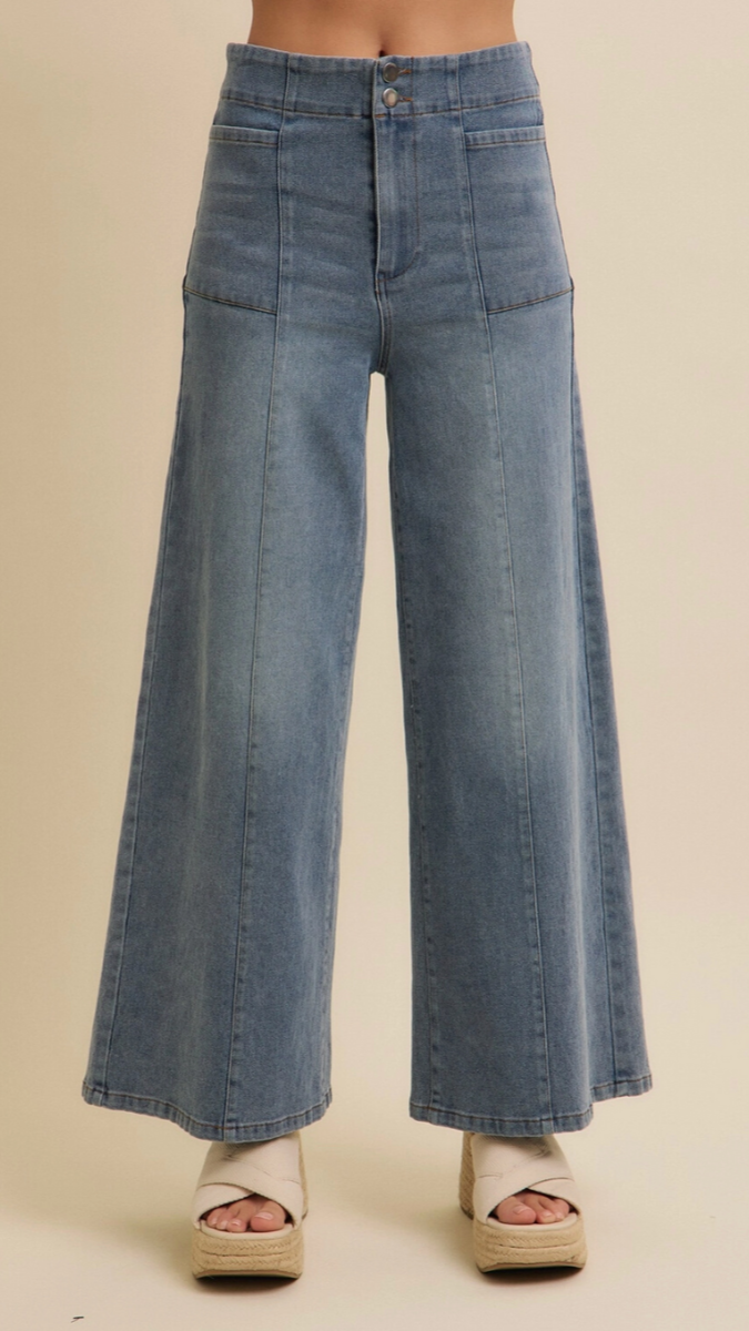 Front view of high-waisted wide-leg denim jeans in vintage blue.

