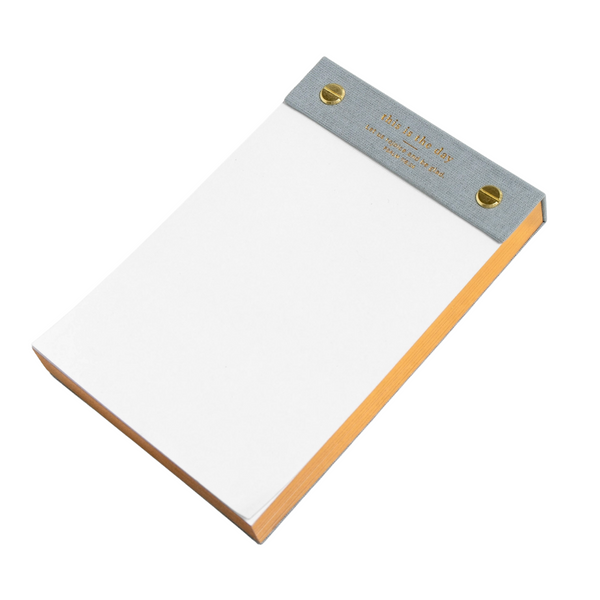 Image 1: Angled view of "This Is The Day" scripture notepad with gold-edged pages.

