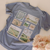 "Christian graphic tee with postage stamp patchwork design on slate blue fabric"

