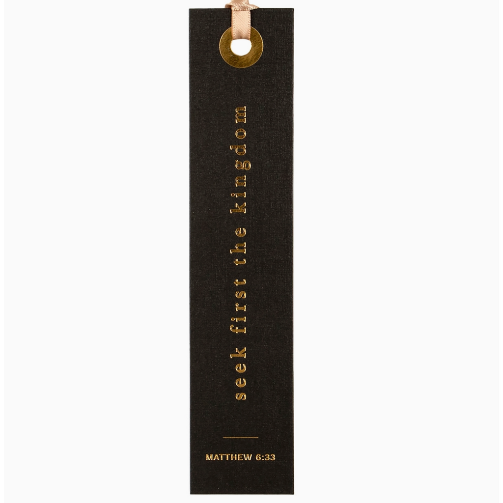 "Black foil-pressed bookmark with scripture Matthew 6:33 - 'Seek first the kingdom' in gold lettering.