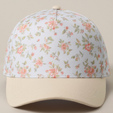 Close-up front view of cream and pink floral baseball cap with beige brim

