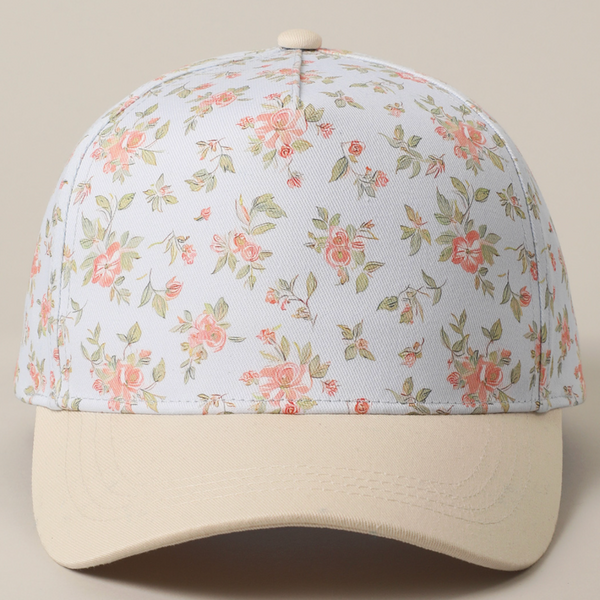 Close-up front view of cream and pink floral baseball cap with beige brim
