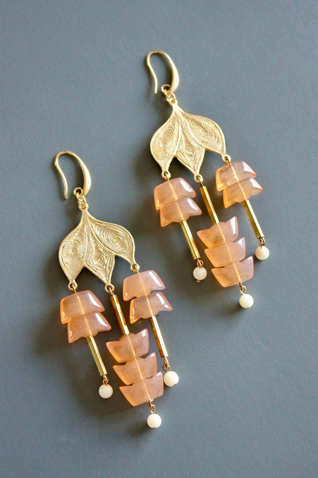 Peach glass and gold plate chandelier earrings