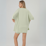 Image 2: Back view of sage oversized t-shirt and biker shorts set

