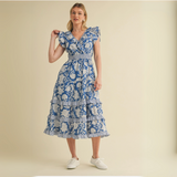 Front view of woman modeling blue floral midi dress with smocked waist.

