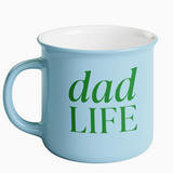 Close-up of green “Dad Life” printed on a coffee mug

