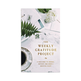 Flat lay photo of The Weekly Gratitude Project with coffee, greenery, and paper

