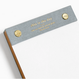 Image 2: Close-up of "This Is The Day" notepad showing Psalm 118:24 in gold foil.

