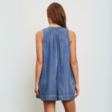 Back view showcasing the pleated detail and structured design of the romper.