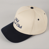 Two-tone trucker-style cap in cream and navy for dads


