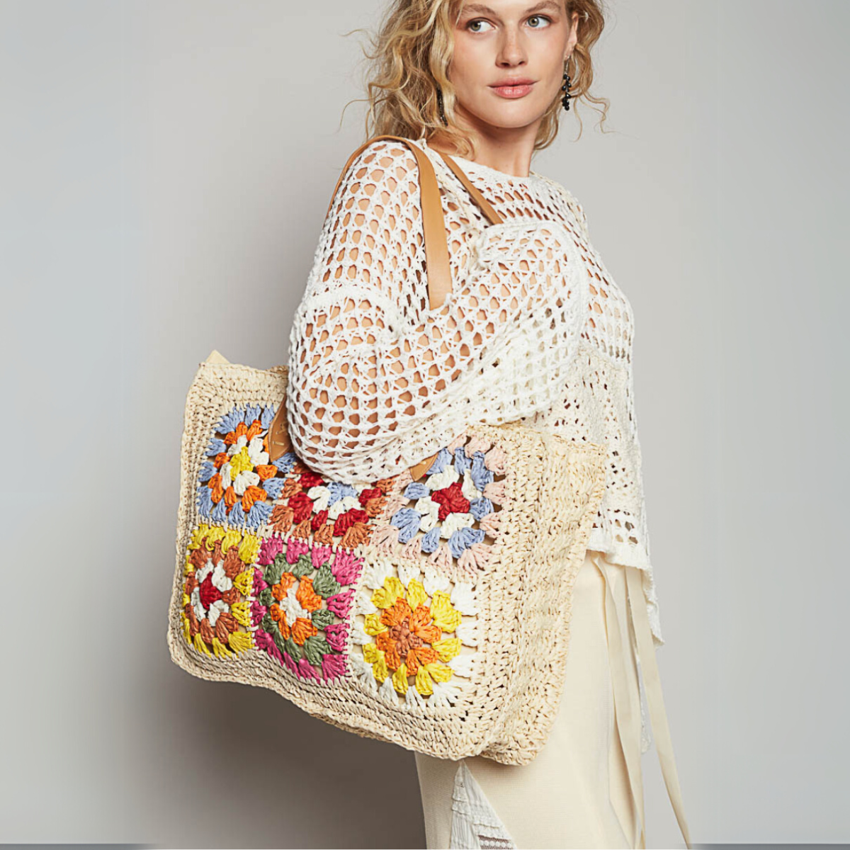 Side profile showcasing the woven texture of the bag and its spacious design.