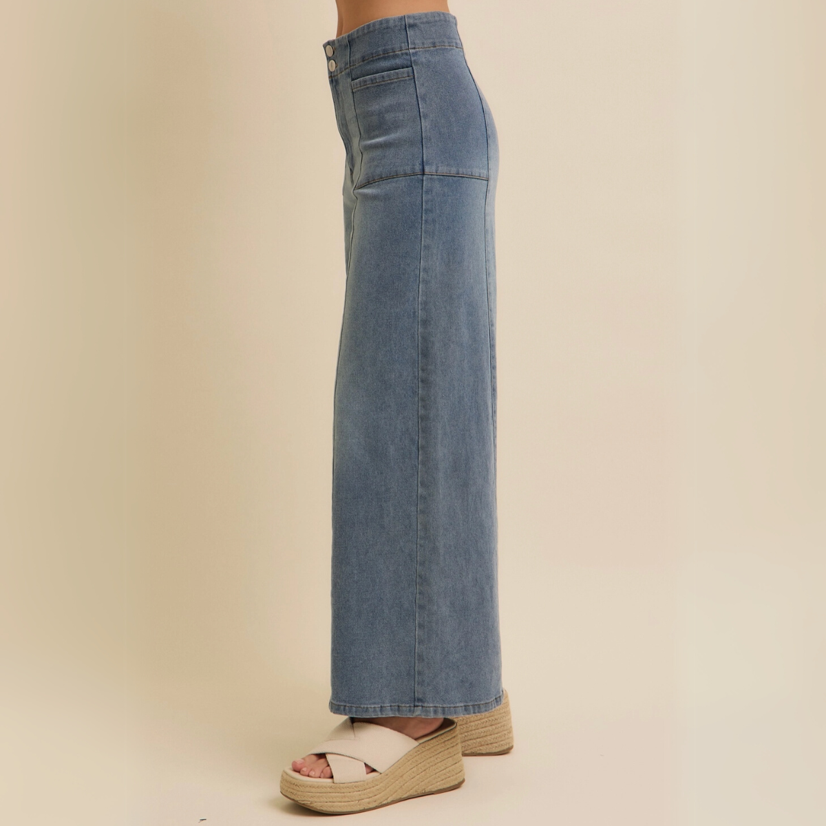 Right profile highlighting the relaxed wide-leg design of vintage blue jeans.
