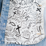 Inner lining detail featuring faith-based doodle artwork in black and white.
