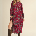 Side view of floral tiered midi dress, highlighting A-line skirt and tiered lace trim.
