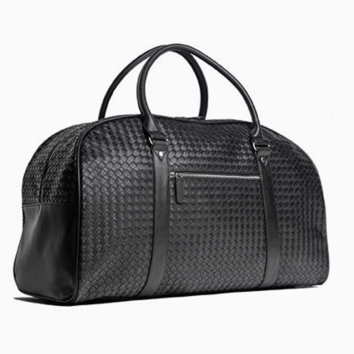 Angled view of luxury woven leather weekender bag with top handles and spacious design for travel essentials.
