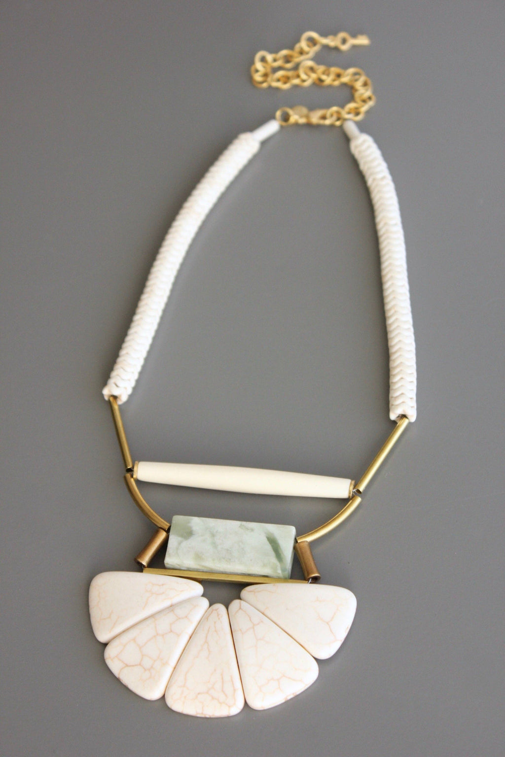 Magnesite, horn, serpentine, and brass necklace