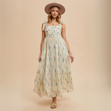Front-facing view of floral maxi dress with gentle pleats and square neckline


