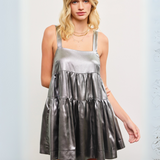 Full front view showcasing the dress's tiered design and metallic shine.