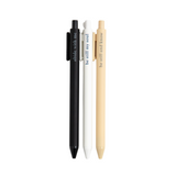 Faith-based pens writing spiritual phrases in ink, laid out on a flat-lay with a notepad.

