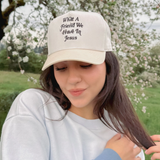 Woman styling the embroidered faith cap with a casual, relaxed outfit.