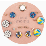 Mini Momo Volleyball Earring Set featuring blue glitter, yellow-white volleyball-themed stud earrings displayed on a tan round leather card
