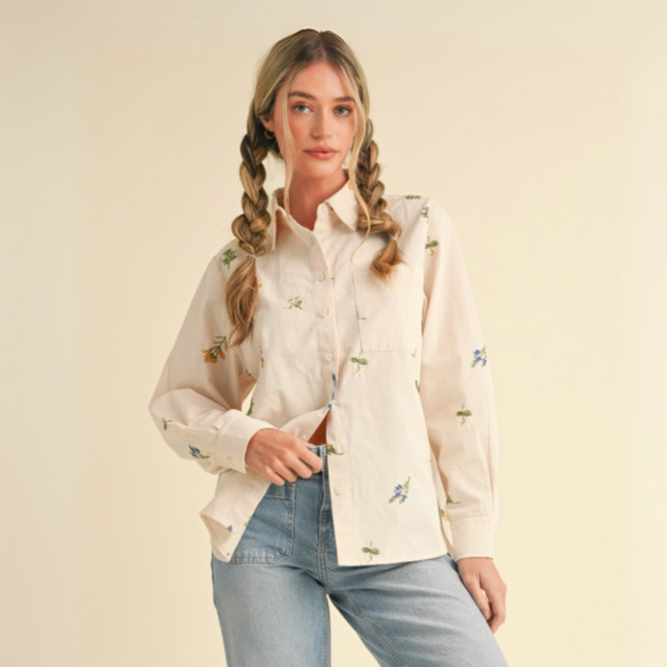 Front view of a Floral Embroidery Button Down Shirt with a collared neckline and cuffed long sleeves.