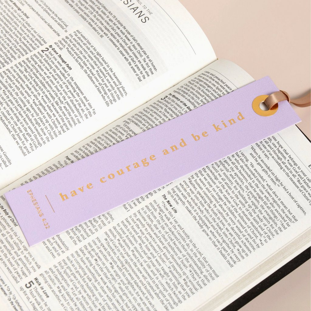 "Foil-pressed lavender bookmark displayed in Bible with verse Ephesians 4:32."


