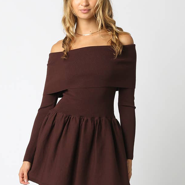 Woman wearing a brown off-shoulder dress on a white background