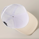 Inside view of blue floral baseball cap showing white lining and adjustable closure