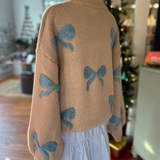 Back view of the Ribbon Pattern Balloon Sleeve Sweater, showcasing the ribbon design and loose, comfortable fit.