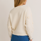 Back view of the Strawberry Embellished Knit Sweater showcasing clean lines and soft, cozy material.