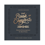 Cover of “The Book of Comforts: Genuine Encouragement for Hard Times” featuring gold embossed title on navy hardcover.