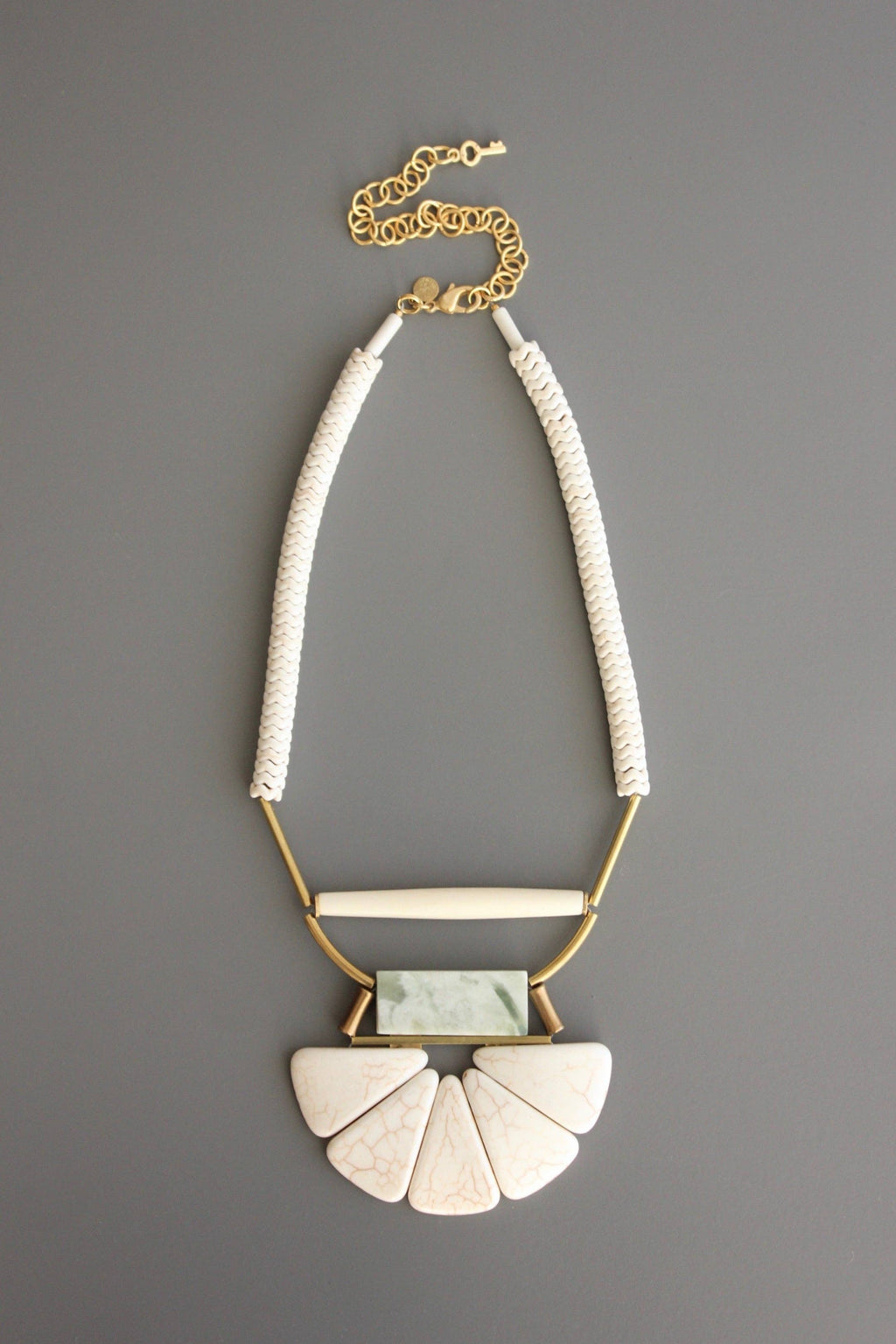 Magnesite, horn, serpentine, and brass necklace