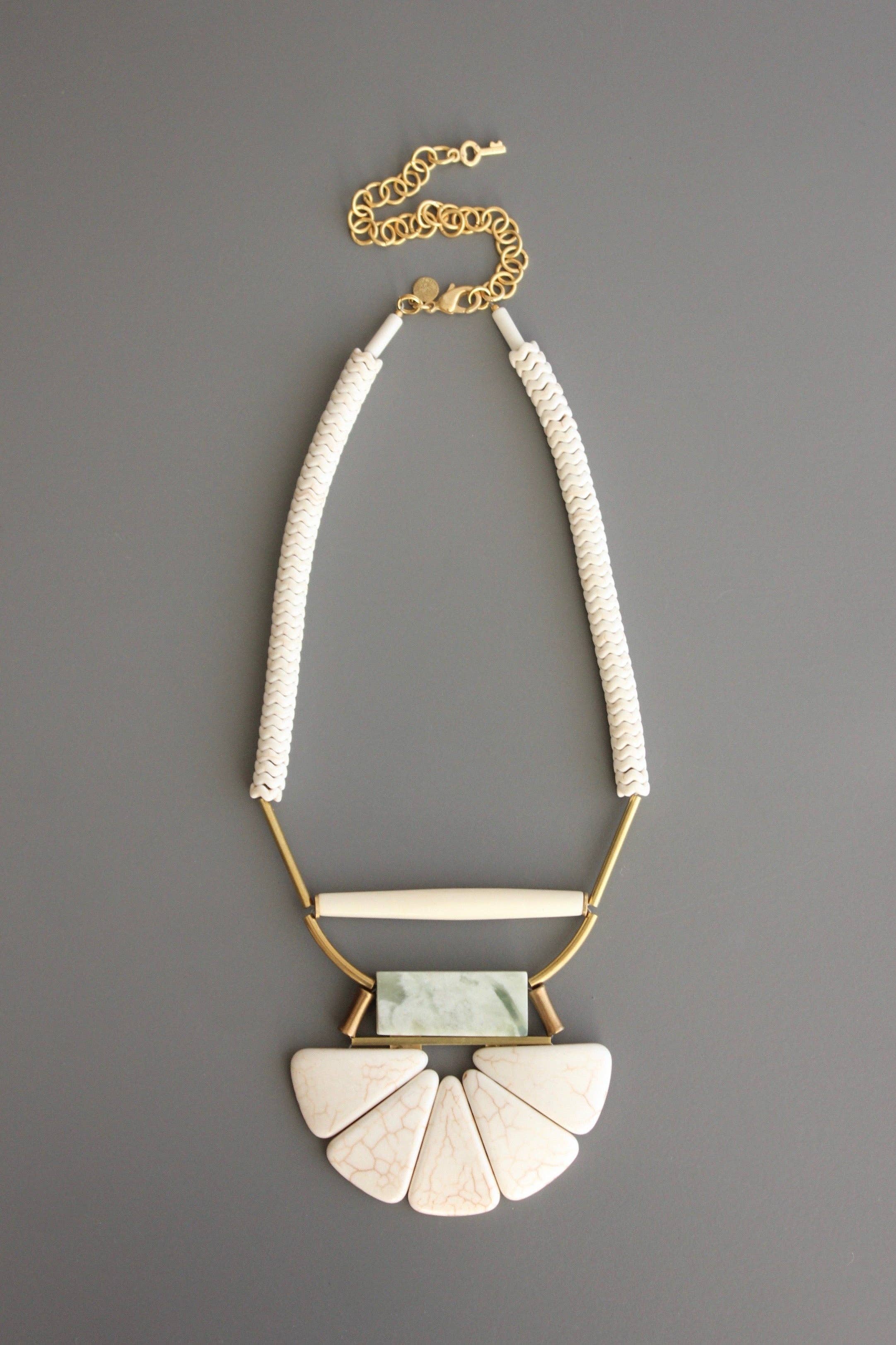 Magnesite, horn, serpentine, and brass necklace