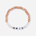Wooden beaded bracelet with white beads and 'WWJD' letters on a white background