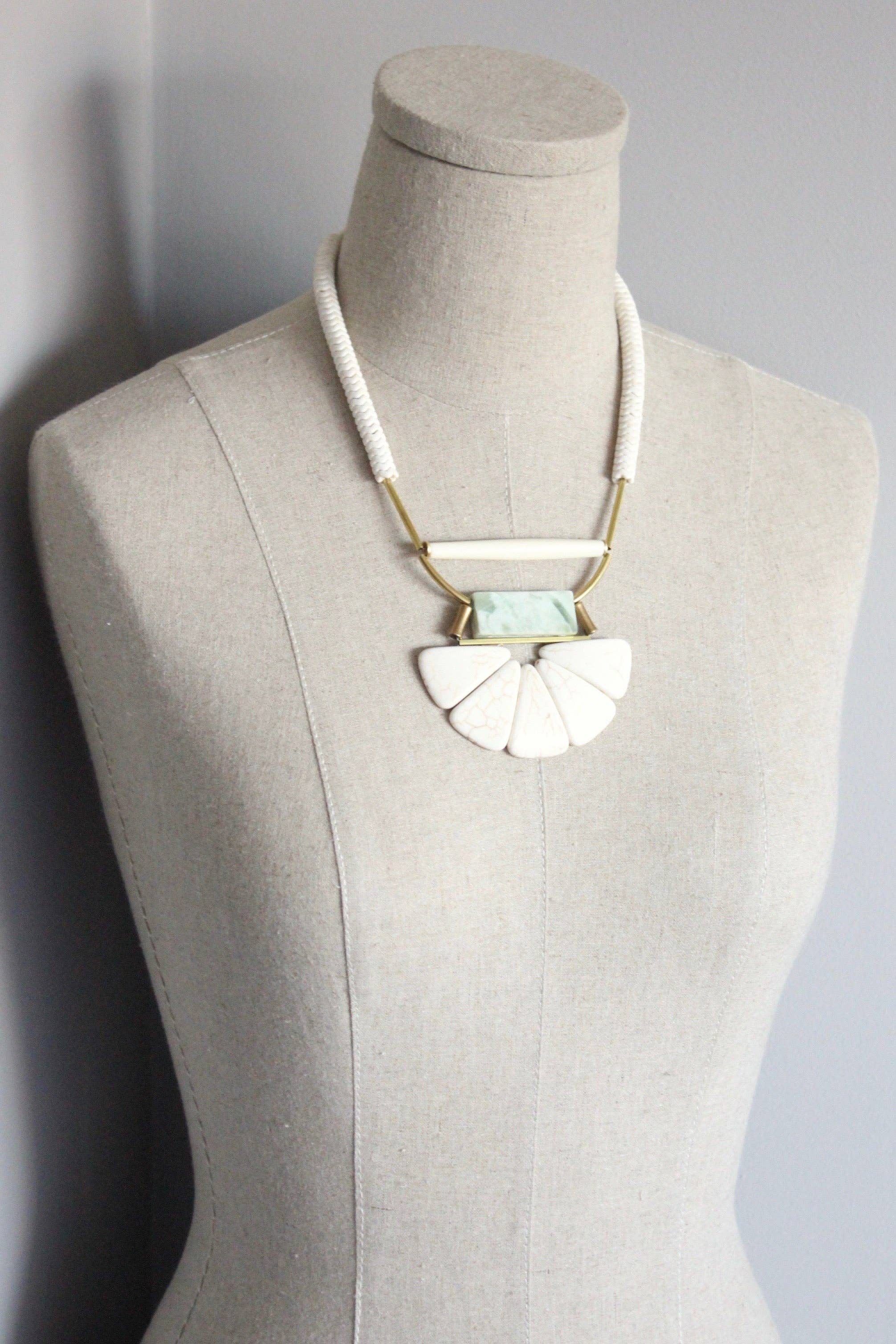 Magnesite, horn, serpentine, and brass necklace