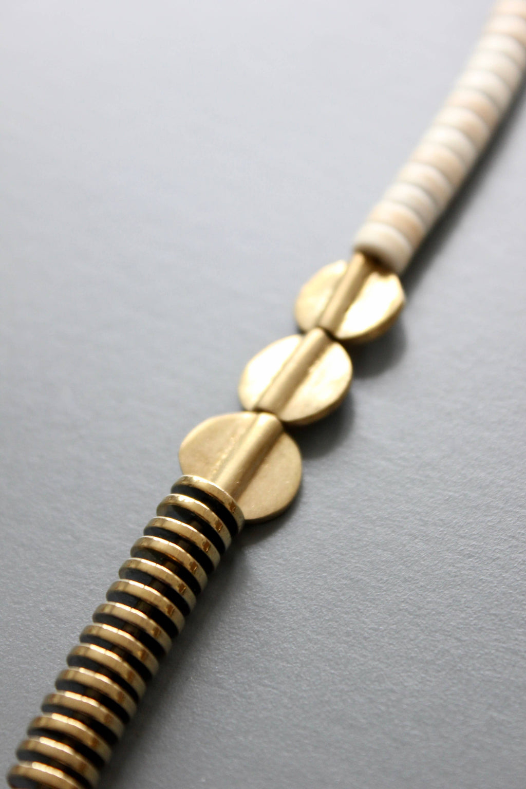 Gold hematite and white disc necklace